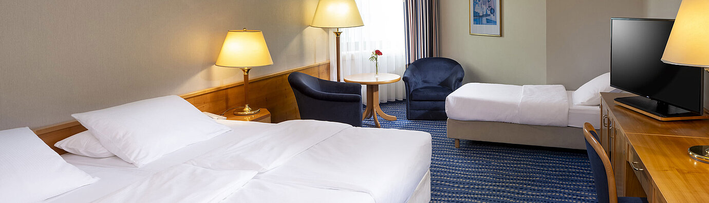 Classic Familienzimmer Classic Familienzimmer mit zwei Betten, Schreibtisch, Flachbildfernseher